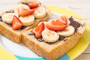 whole wheat bread with fresh banana, strawberry and chocolate