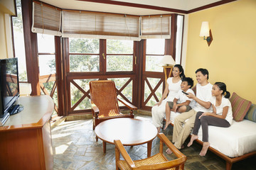 Family watching television together