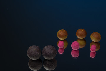 Boilies, fishing baits, close up, Fishing baits for carp. Baits for carp. Fishing gear.