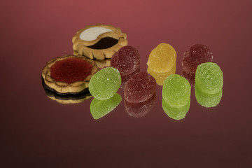 Several marmalade sweets isolated on a red background