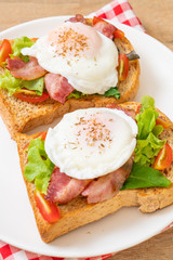whole wheat bread toasted with vegetable, bacon and egg