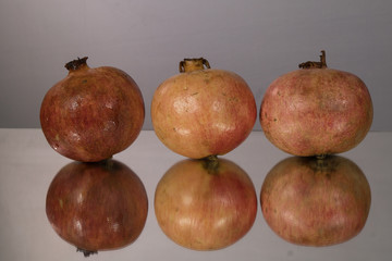 Red juice pomegranate on dark background