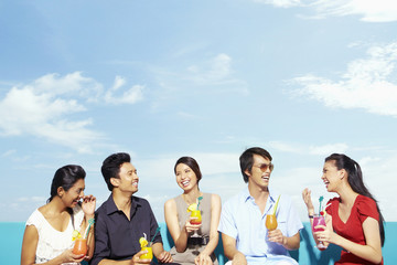 Group of people laughing and talking