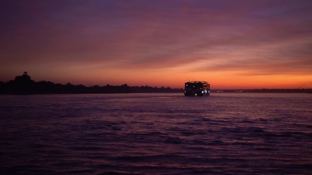 Sunset in the middle of Nile river crusing famous tourist activity in Egypt