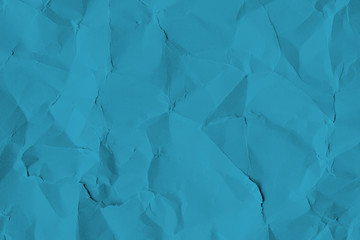 Crumpled blue paper textured background