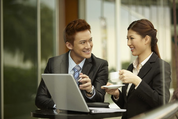 Businessman and businesswoman having discussion