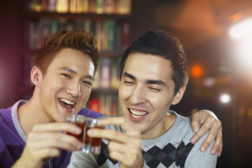 Men drinking at a bar