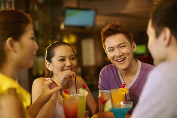 Friends chatting and drinking