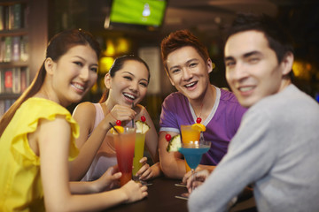 Friends chatting and drinking