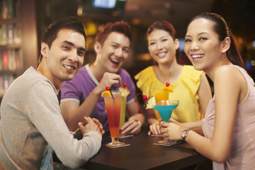 Friends chatting and drinking