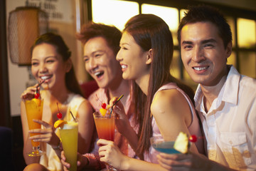 Group of friends drinking and having fun