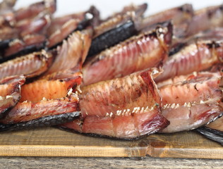 Russian fish.Sliced dried salted freshwater fish carp, which is commonly called balyk, is laid out on a wooden grate for ventilation.