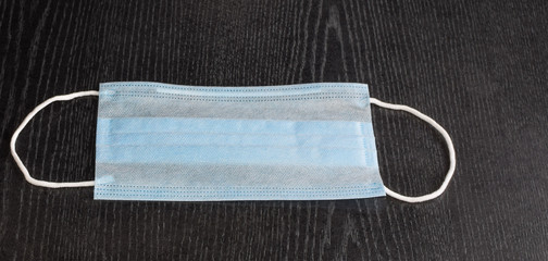 Medical mask on a dark background