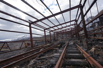 Fototapeta premium Metal remains of abandoned coal mining town on Spitsbergen.