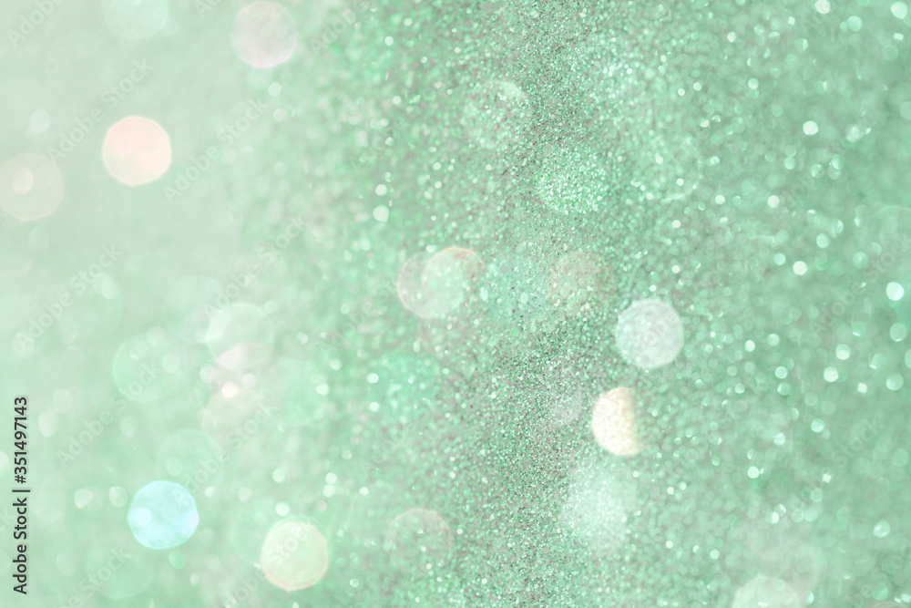 Wall mural glittery bokeh pattern on a green background