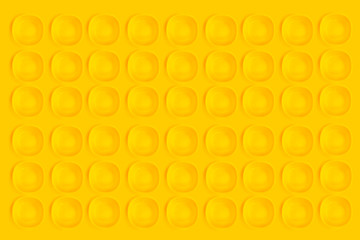 Yellow plates on a yellow background.