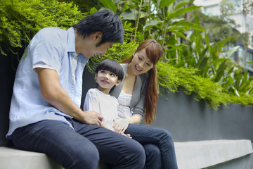 Fototapeta premium Family sitting together outdoors