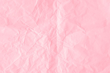 Crumpled flamingo pink paper textured background