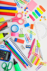 School supplies on white desk. Kids creativity flat lay
