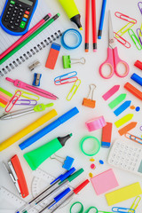 School supplies on white desk. Kids creativity flat lay