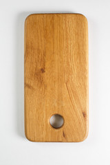 Brown board for slicing food on a white background
