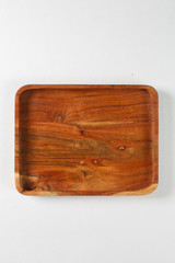 Brown wooden board for food on a white background