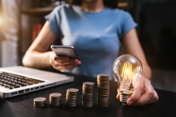 business hand showing creative business strategy with light bulb as concept