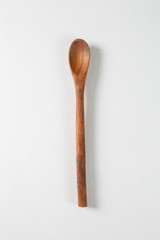 Wooden spoon on a white background