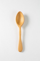 Wooden spoon on a white background
