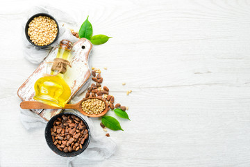 Pine nuts oil and pine nuts. Superfood. free space for your text. Top view.