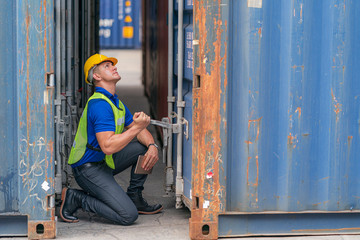 Fototapeta na wymiar Inspector/Foreman/Engineer working on equipment inspection at container yard