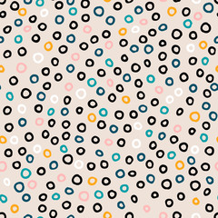 Seamless Scandinavian pattern. Black, gold, pink, blue, white hand-drawn rings on a pastel background. Neutral cozy ornament. Vector illustrations with circles for wallpaper, posters, wrapping paper