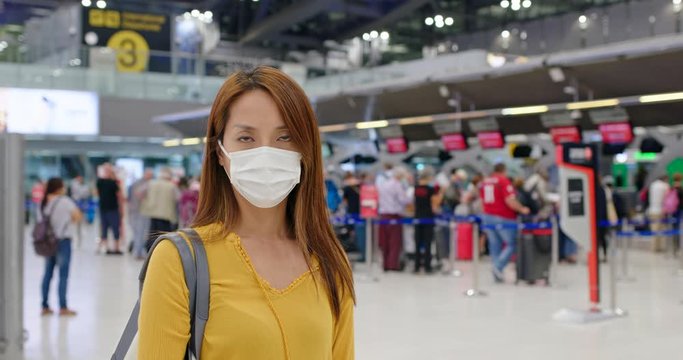 Woman wear face mask at airport
