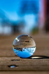 Emden harbor seen through a glass ball