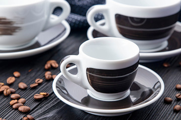 black cups on black background