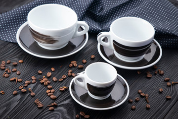black cups on black background