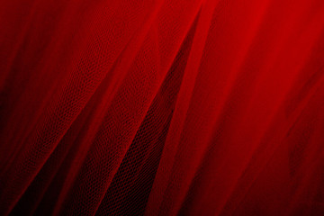 Red tulle drapery textured background