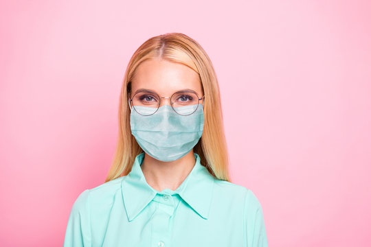 Closeup photo of cute lovely girl professional lady working quarantine time want stay safety healthy wear teal shirt protective facial cold flu mask isolated pink background