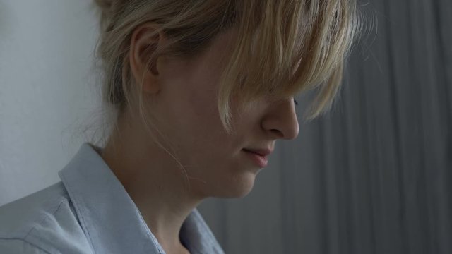 Closeup woman hiding and crying, suffering from domestic violence, humiliation