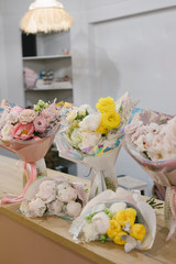 Five beautiful bouquets of flowers. Flower shop concept. Stylish bouquets of flowers.