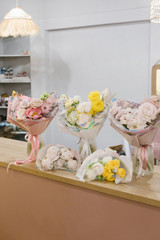 Five beautiful bouquets of flowers. Flower shop concept. Stylish bouquets of flowers.