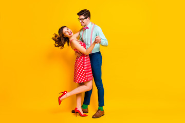 Full size photo of two people girl guy dance ballroom hold hand enjoy wear suspenders stilettos...