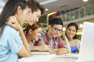 Students having study group in library