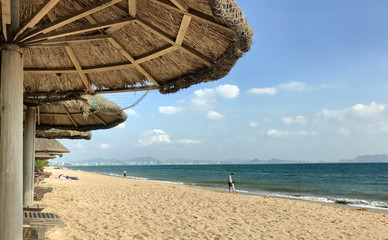 Fototapeta na wymiar Beach umbrella made from natural fibres in Sanya, Hainan Island, China