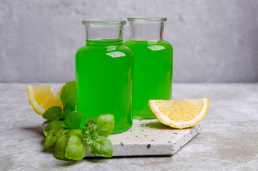 Green liquid in a glass bottle