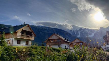 Fototapeta na wymiar Wooden chalets in a luxurious family resort in the alps mountain range of Austria, Europe