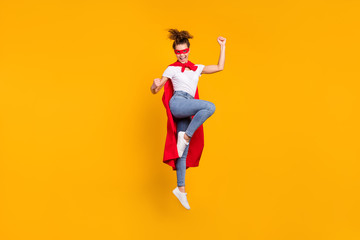 Fototapeta na wymiar Full length body size view of her she nice attractive slim fit thin cheerful cheery girl jumping wearing cape rejoicing having fun isolated on bright vivid shine vibrant yellow color background