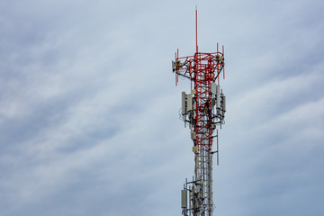 Telecommunication tower with blue sky and white clouds. Worker installed 5g equipment on telecommunication tower.Communication technology. Telecommunication industry. Mobile or telecom 4g network.