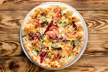 Delicious italian pizza served on wooden table