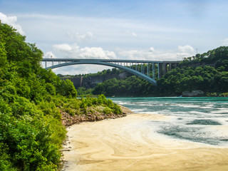 Niagara Falls, Horseshoe Falls, also known as Canadian Falls, is the largest of the three waterfalls that collectively form Niagara Falls on the Niagara River along the Canada–United States